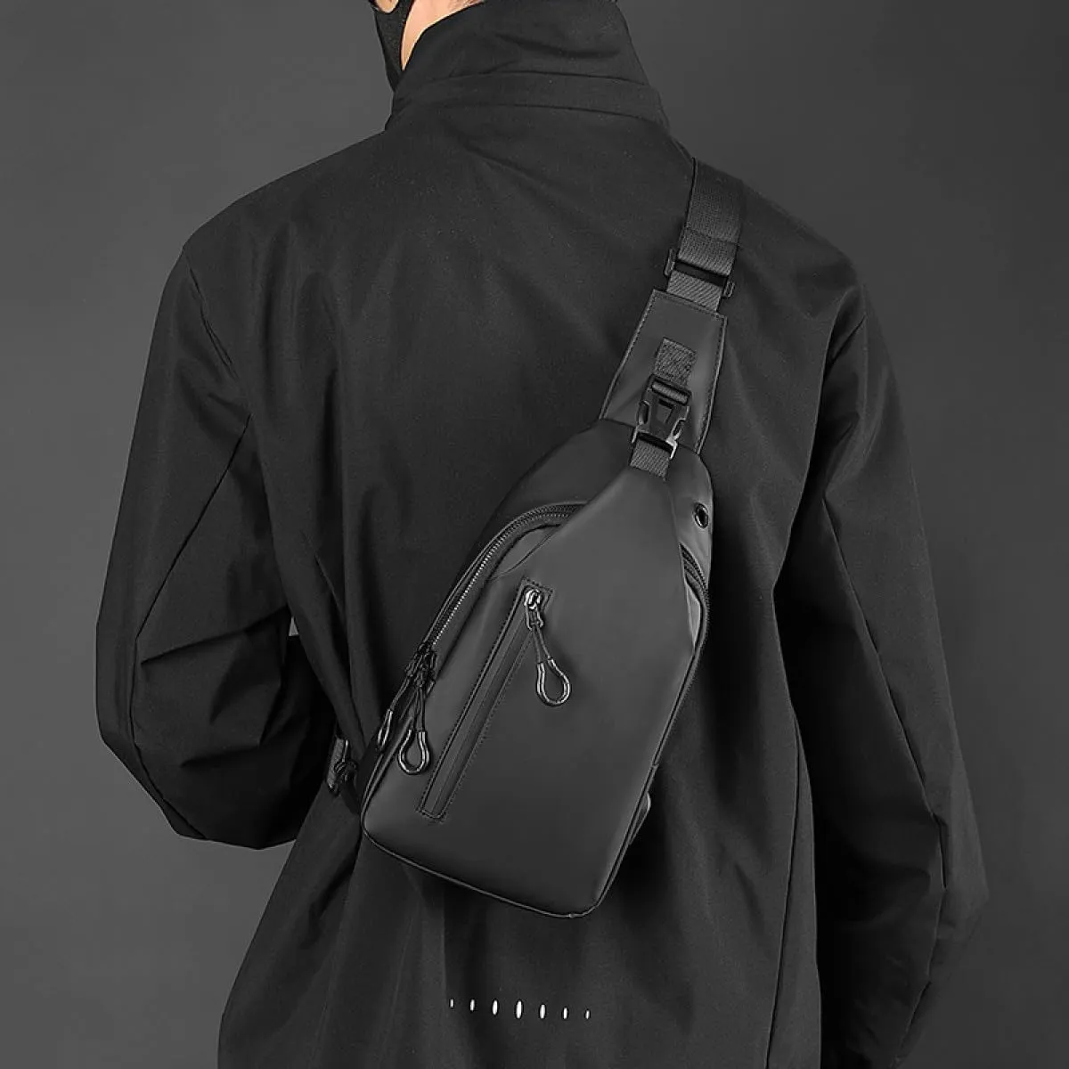 Large-capacity multi-compartment storage bag, portable outdoor shoulder bag, equipped with headphones and a USB charging port.(Black earphones, charging double-layer zipper model.)